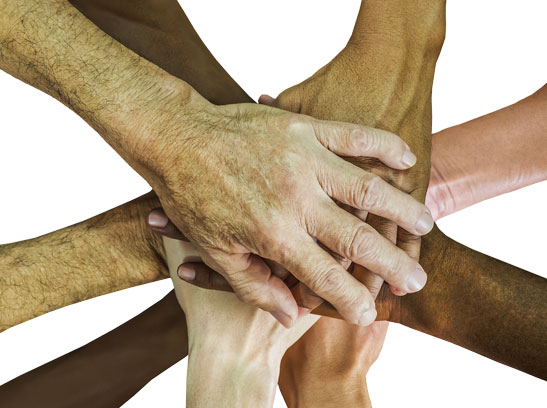 Group of people with their hands in - teamwork